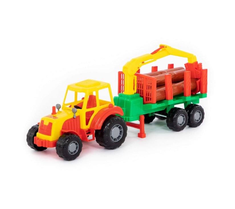 Polesie traktor s balvanima u prikolici